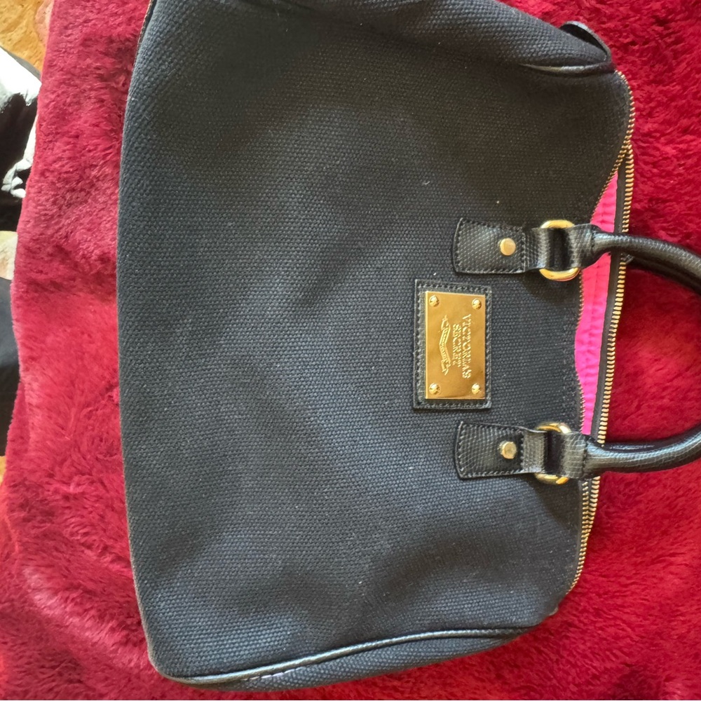 Black Coach Handbag with Gold Accents